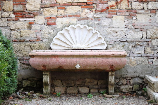 Ancient wall funtain in Verona, Italy