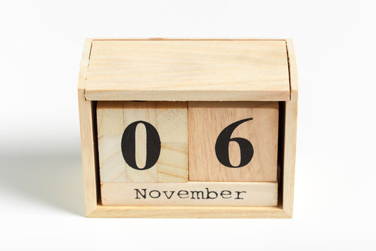 Wooden cubes with date on white background. 6th of November