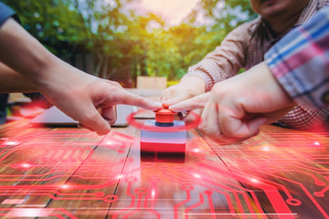 Multiple hands join for push the emergency stop button for stop circuit system. Concept STOP