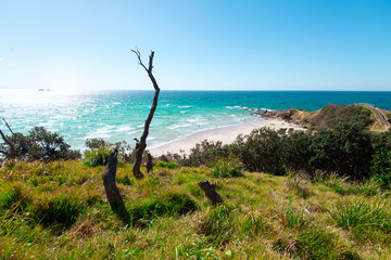The Byron Bay with the with sand beach and the turquoise blue sky water.