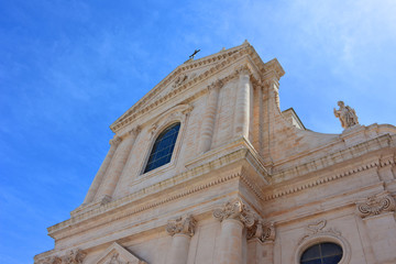 Fototapeta na wymiar Italy, Puglia region, Locorotondo, a whitewashed village in the heart of the Itria valley, an external view of the mother church of San Giorgio