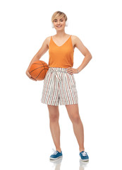 sport, leisure and people concept - smiling teenage girl in headphones with basketball over white background