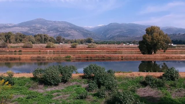 Flying thru the fields and lake to the mountains