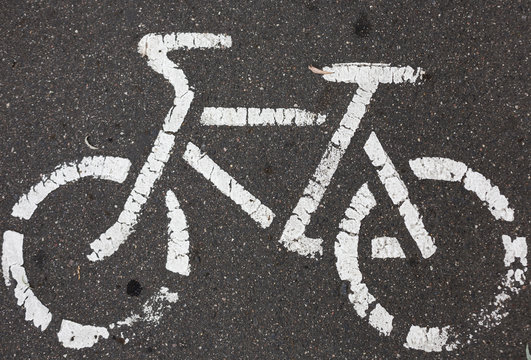 Bicycle sign on the asphalt bicycle lane