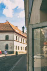 City life with passers-by and reflection