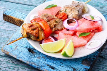 Shish kebab with watermelon garnish