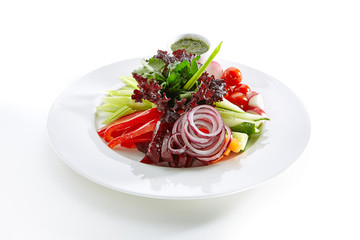 Plate of Seasonal Vegetables, Pickles and Greens Isolated