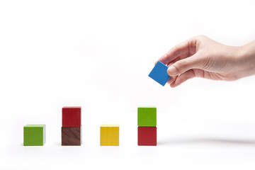woman hand hold a wood block isolated white