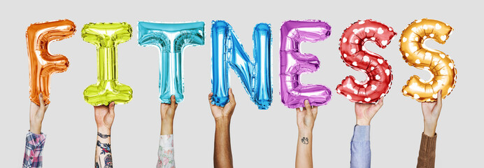 Hands showing fitness balloons word