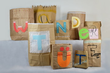big paper surprise bags with german lettering WUNDERTÜTE on it, which means surprise bag