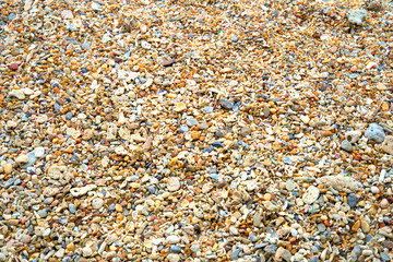 Pebbles on the beach at the sea in Thailand.