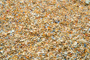Pebbles on the beach at the sea in Thailand.