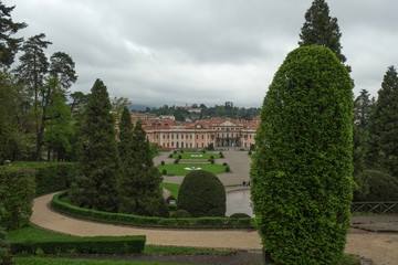 Obraz premium Estense Palace, or Palazzo Estense, the residence of Franchesco III d'Este, Duke of Modena and Reggio, and beautiful green park in front of it, Italy