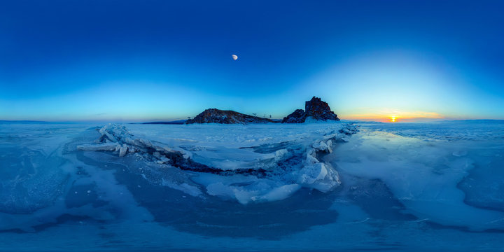 Big cracks in the ice of Lake Baikal at the Shaman Rock on Olkhon Island. Spherical 360 degree vr panorama.