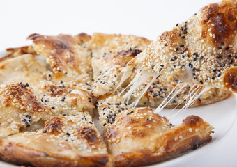 a turkish pide sileced on white background