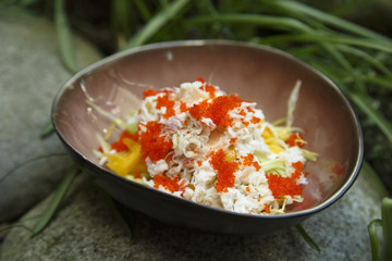 Crab salad with cucumber and caviar