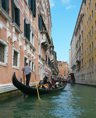 Obraz na płótnie Canvas Venice,Italy-July 25, 2018: Traffic jam of Gondolas near S. Moise Gondola pier, Venice 