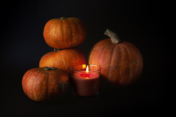 ripe pumpkins and candle
