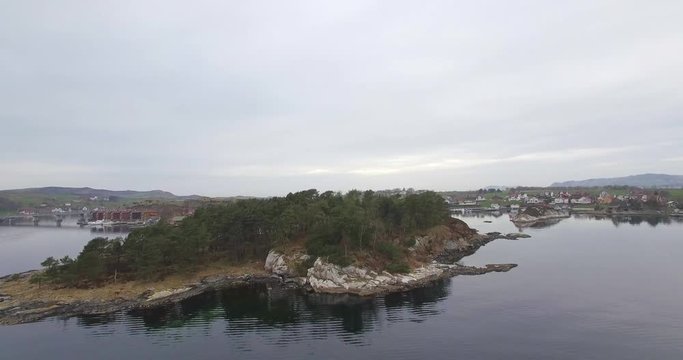 4k Drone footage over smal Island reviling great view with bridge in the background.