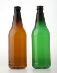 Empty brown and green plastic bottles for beer or other beverages