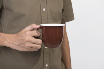 Hand Holding brown coffee cup. mockup for creative design branding. © NaMong Productions
