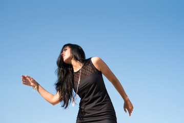 Fototapeta na wymiar Fashion woman on sky background