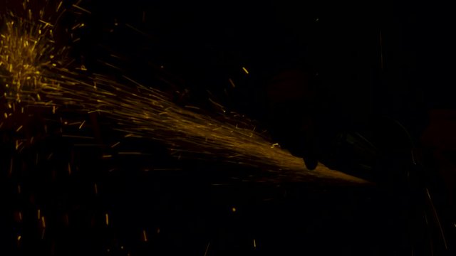 sparks effect - worker cutting iron