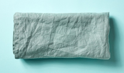 Cotton napkin on blue, from above