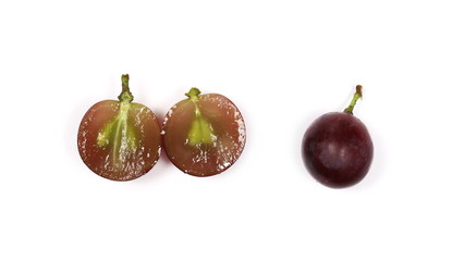Cardinal grapes sliced in half isolated on white background, top view