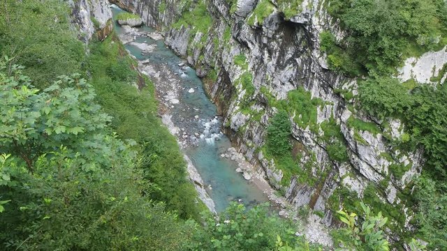 Colore, Bergamo, Italy. Dezzo creek at the bottom of steep rock cliffs and mountain ravine. Shoot from Via Mala an historical route in Scalve Valley