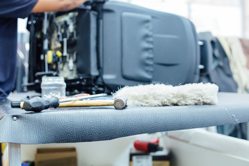 Tools for leather upholstery on work table