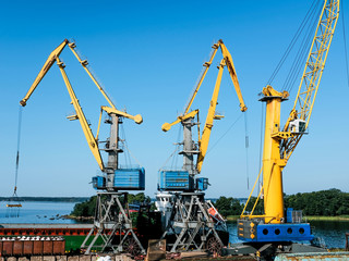 Working day in the port, cranes, loading