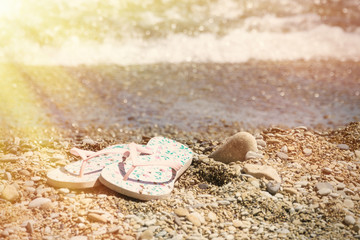 Slap on the beach, the ocean. The concept of rest, summer, warmth.