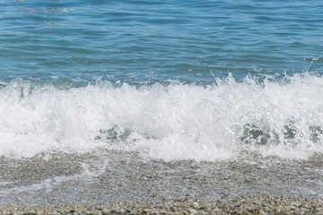Sea waves on pebbles.