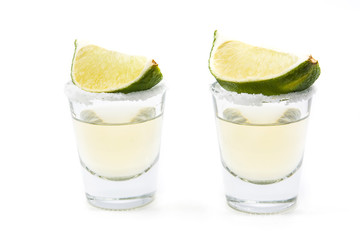 Mexican Gold tequila with lime and salt isolated on white background