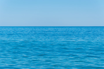 The blue surface of the sea water, the ocean.