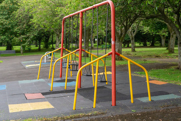 Fototapeta na wymiar Children's Swings in a Scottish Park