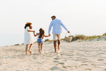 Happy family having fun together at the beach.