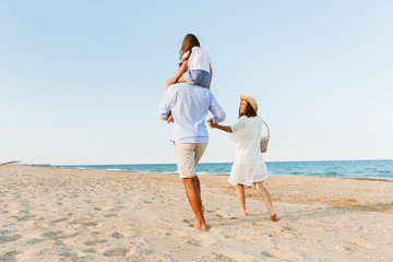 Happy family having fun together at the beach.