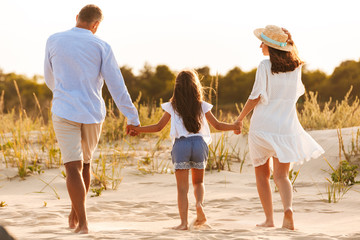 Happy family having fun together at the beach.