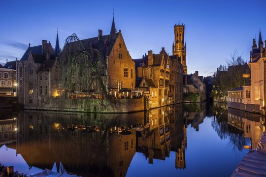 Guild houses in front of the Belfry at dusk, historic centre at Rozenhoedkaai, UNESCO World Heritage Site, Bruges, Flemish Region, Belgium, Europe