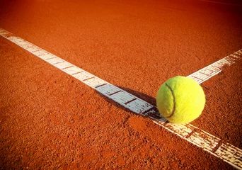 Poster Tennis balls on a tennis clay court © Željko Radojko