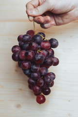 Bunch of grapes in hand