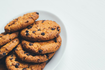 Chocolate cookies of on a plate on a white background