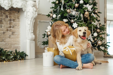 Blonde girl with golden retriever, christmas