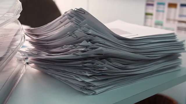 Stack of pappers in the office.