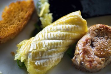 Grilled cheese, beef steak and bread.