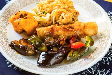 Fried vegetable, spring roll and noodle.