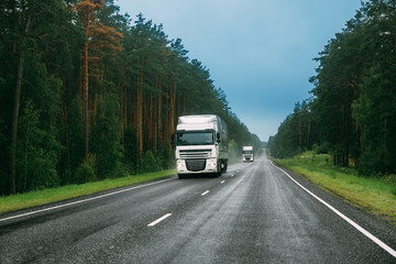 Fototapeta na wymiar Truck Tractor Unit, Prime Mover, Traction Unit In Motion On Road