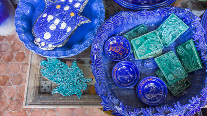Hamsa or Fatima's hand and other ceramic blue pieces.